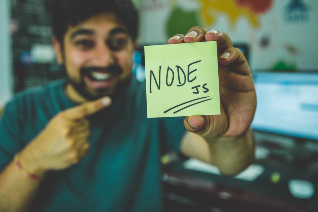 pexels-photo-1261427 Person Holding Node Text